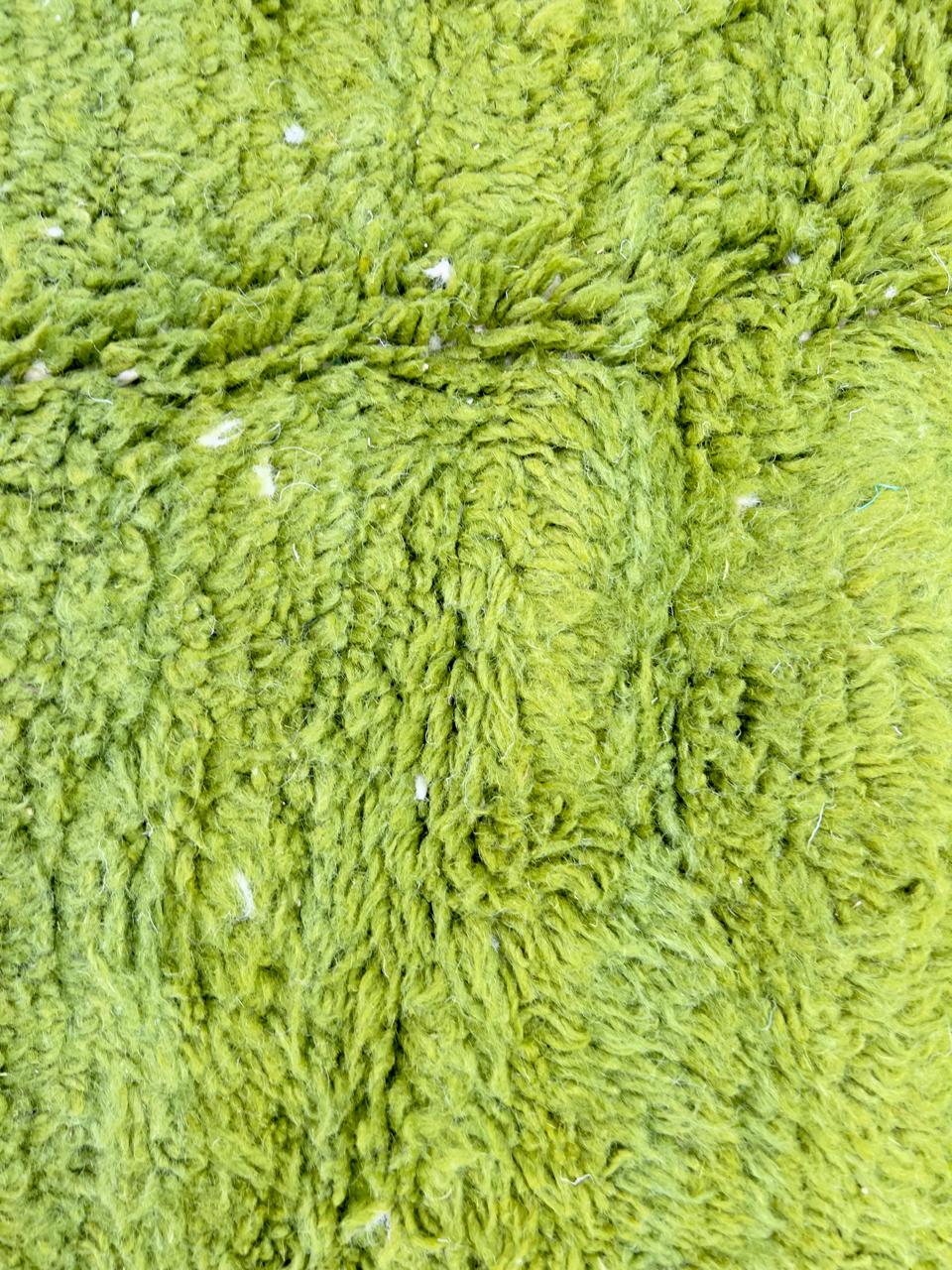 Round abstract Moroccan rug with vibrant green and white organic pattern.