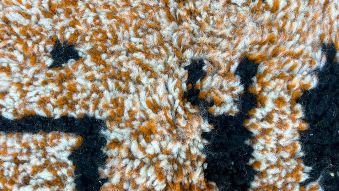 Yellow Moroccan wool rug with abstract Berber design and black line pattern