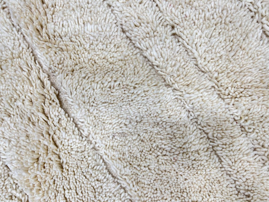 Beige minimalist Moroccan wool rug with tone-on-tone geometric design
