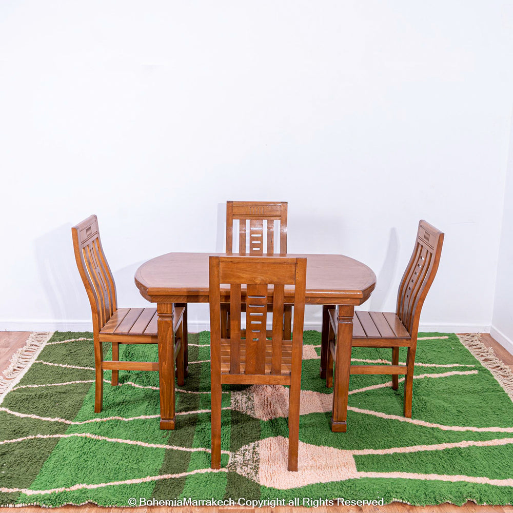 Green Moroccan rug with pink abstract desert motif design, handmade in wool
