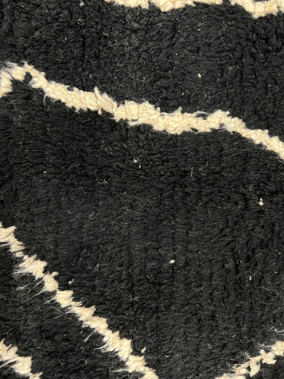 Black and white Moroccan wool rug with modern geometric line design