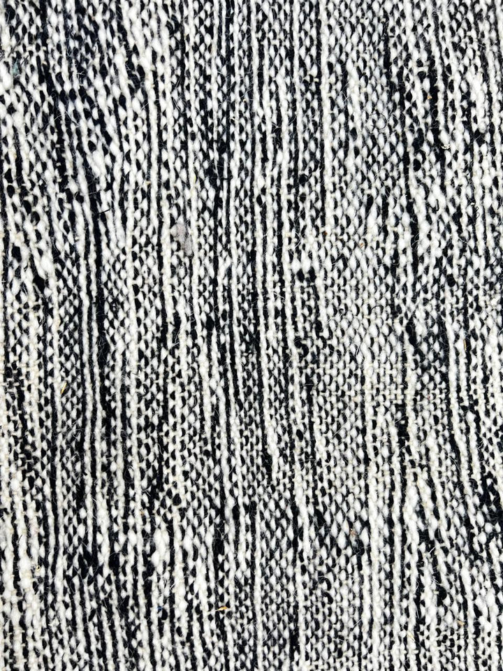Handmade black and white Moroccan kilim runner rug with bold zigzag geometric pattern and flatwoven wool texture