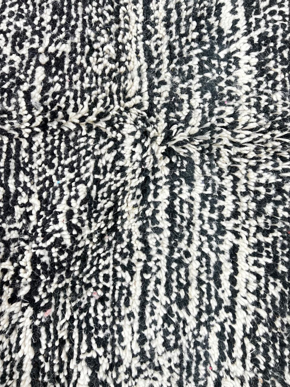 Black and white Moroccan wool runner rug with handmade shag texture and Berber woven pattern, modern boho hallway runner carpet
