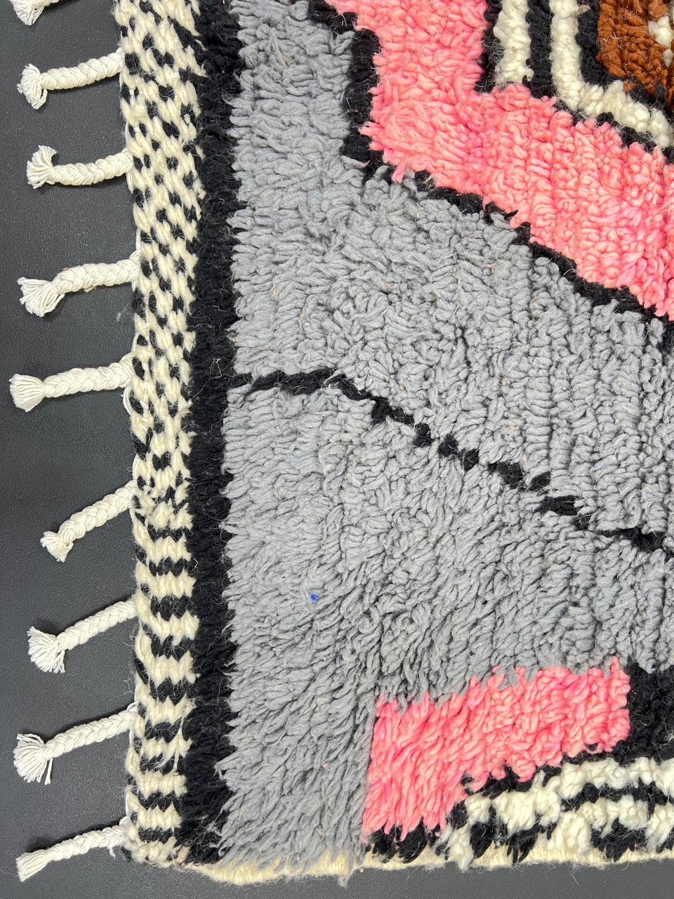 Colorful handmade Moroccan wool rug with abstract geometric pattern