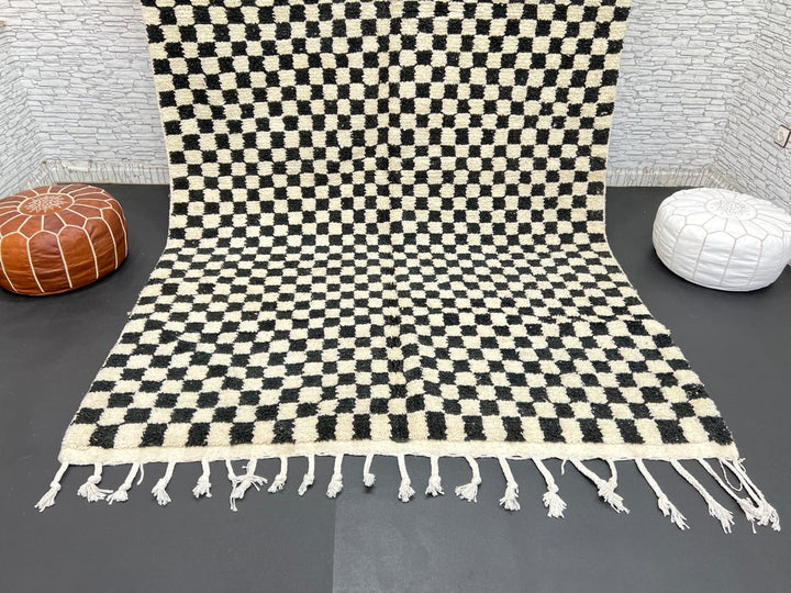 Handwoven black and white Moroccan wool rug with checkerboard pattern