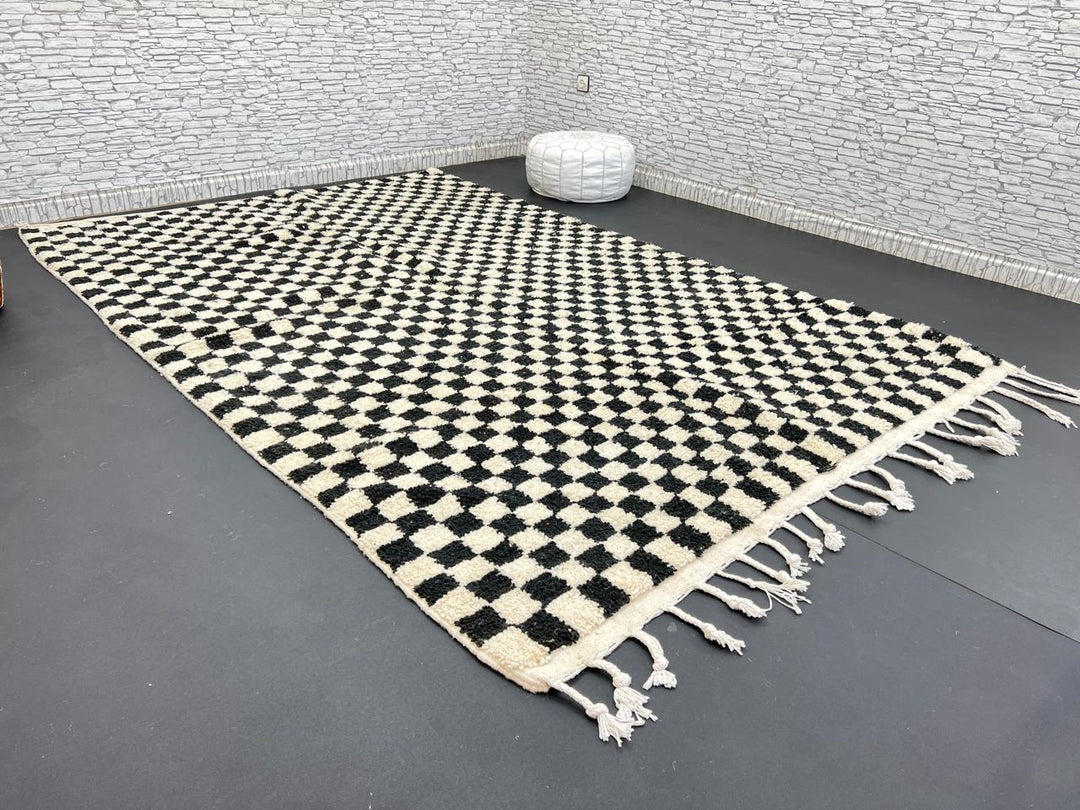 Handwoven black and white Moroccan wool rug with checkerboard pattern