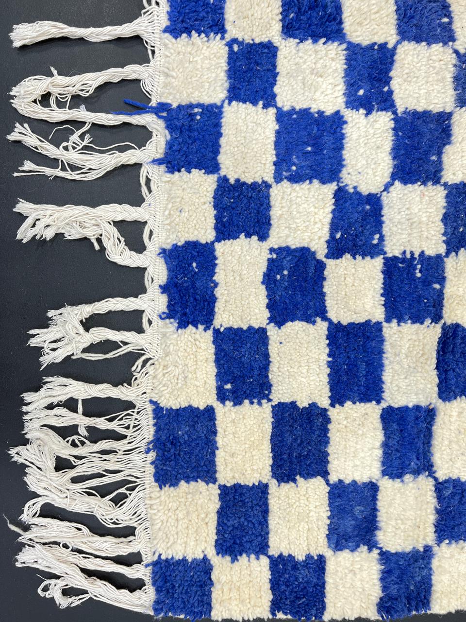 Handwoven Moroccan wool rug with blue and cream checkered design