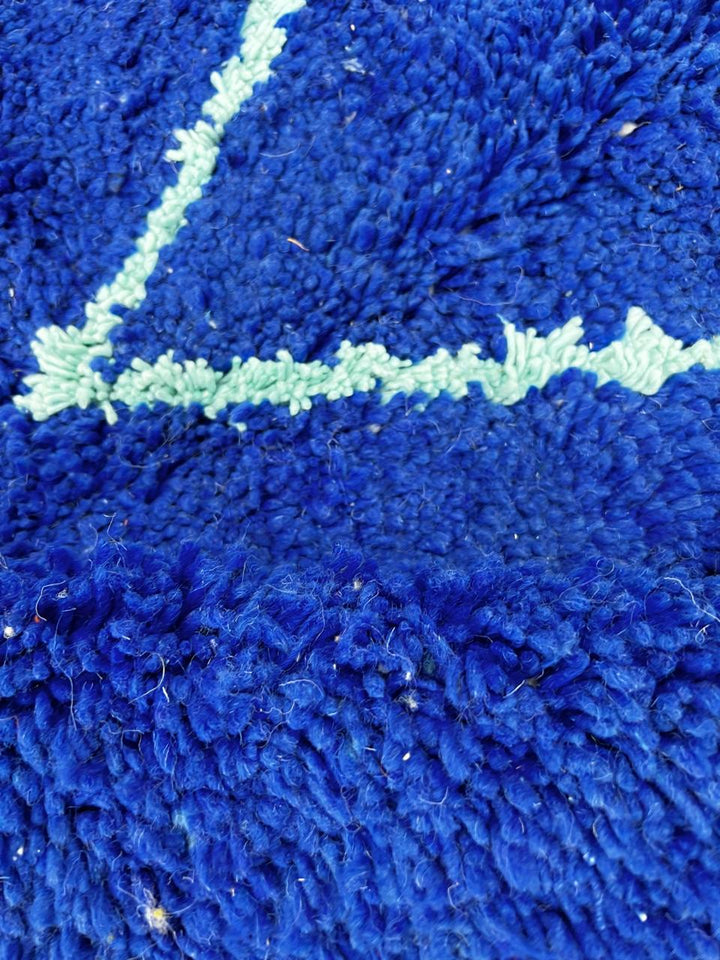Blue Moroccan wool runner rug with light-blue Berber geometric lines, handmade by artisans