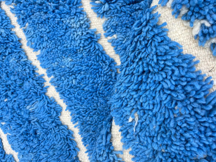 Blue Moroccan wool rug with carved geometric Berber lines, handmade in Morocco