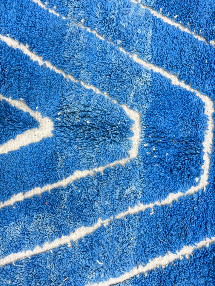 Blue Moroccan wool rug with carved geometric Berber lines, handmade in Morocco