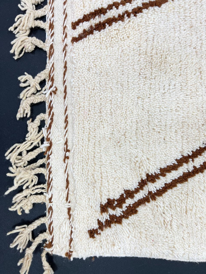 Handmade Moroccan wool rug with brown and beige abstract desert-inspired design