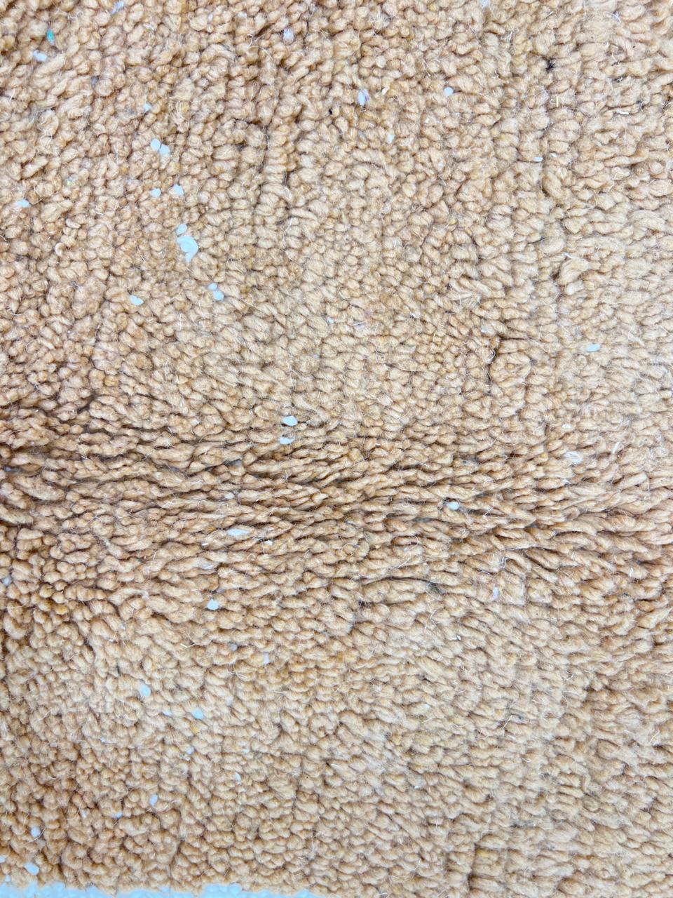 Handmade Moroccan wool rug with brown and beige abstract desert-inspired design