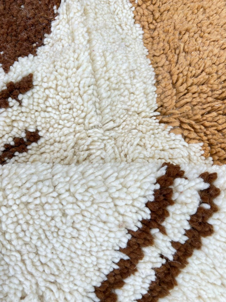 Handmade Moroccan wool rug with brown and beige abstract desert-inspired design