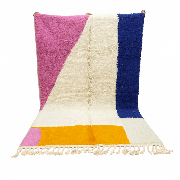 Colorful Moroccan wool rug with pink, blue, and yellow color block abstract design, handmade by Berber artisans