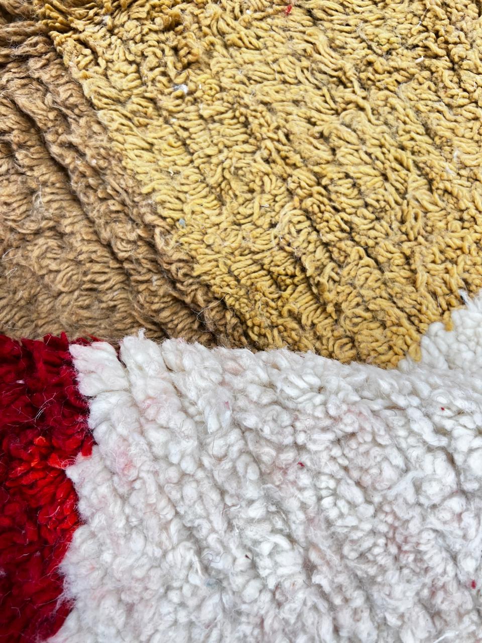 Colorful abstract Moroccan runner rug with artistic face design, handmade wool carpet featuring turquoise, yellow, red and purple shapes on a soft white background, modern boho Moroccan wool runner for hallway decor.