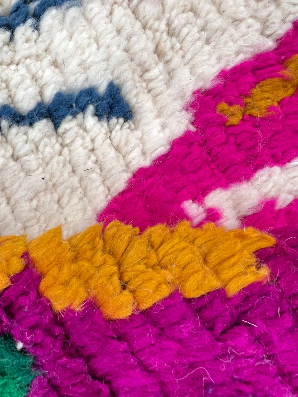 Colorful Berber Moroccan runner rug handmade from white wool with abstract symbols