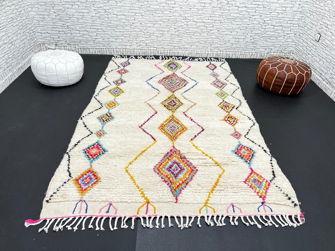 Handmade Moroccan wool rug with colorful diamond patterns on cream background – Berber boho carpet