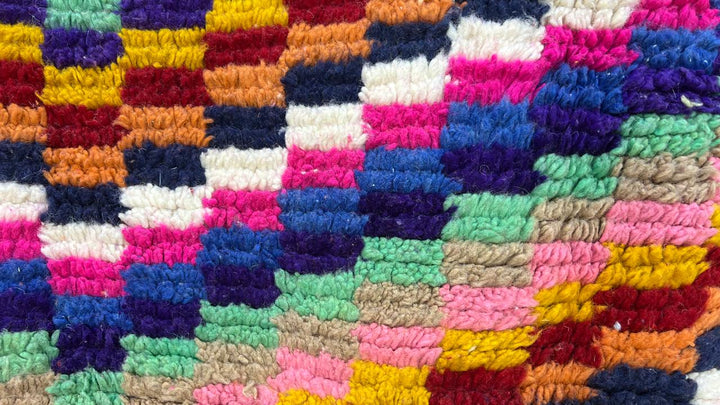 Colorful geometric Moroccan runner rug handwoven from wool with abstract line pattern