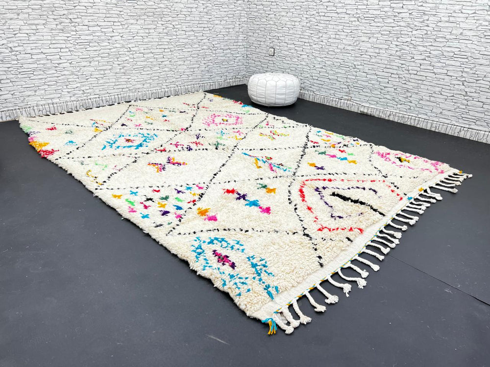 Colorful Moroccan wool rug with multicolor geometric diamond patterns, handmade by Berber artisans