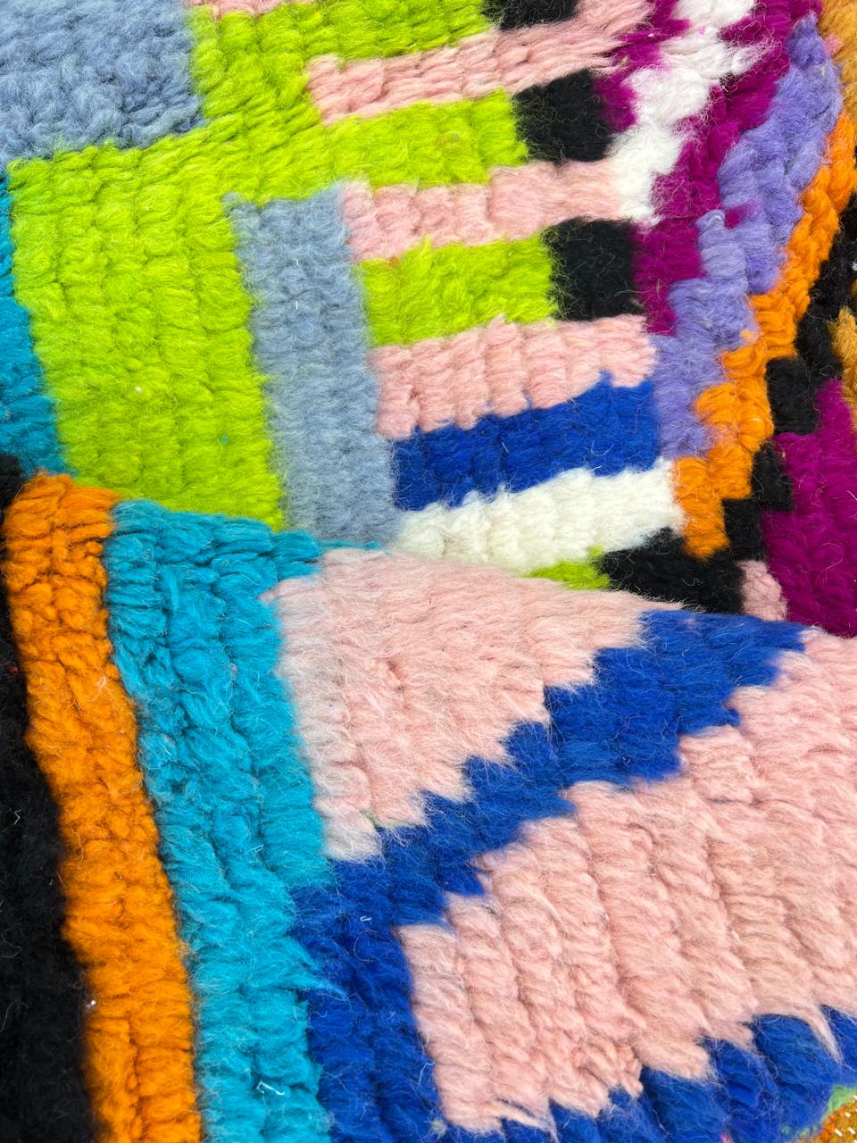 Colorful abstract Moroccan runner rug handwoven in wool with pink, orange, yellow and blue geometric patterns