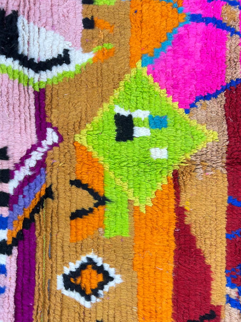 Colorful abstract Moroccan runner rug handwoven in wool with pink, orange, yellow and blue geometric patterns