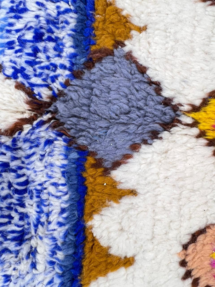 Colorful Moroccan runner rug with geometric Berber patterns in natural wool
