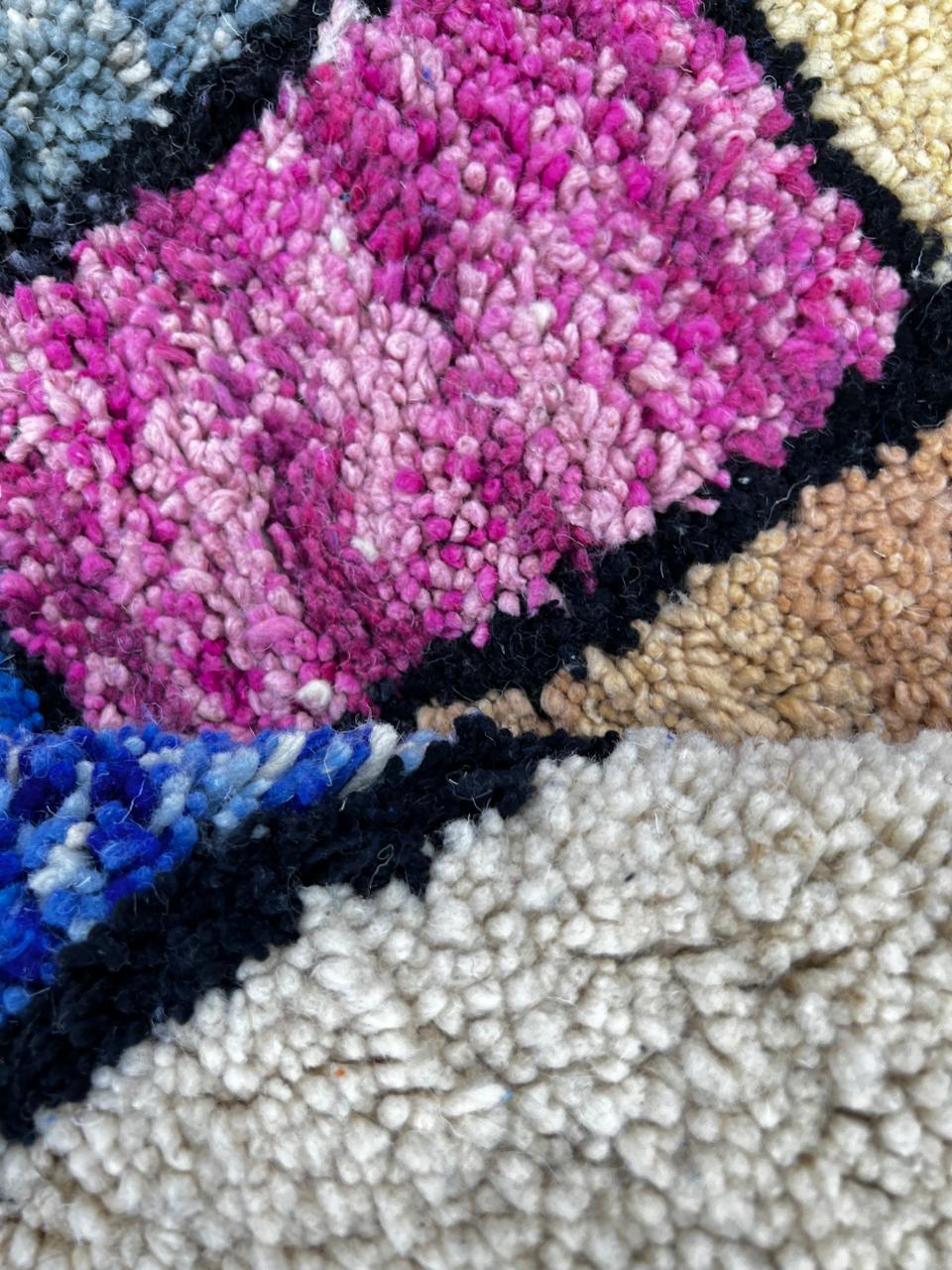 Colorful handmade Moroccan runner rug with abstract wool design, vibrant textured blocks and black border, shag Berber carpet