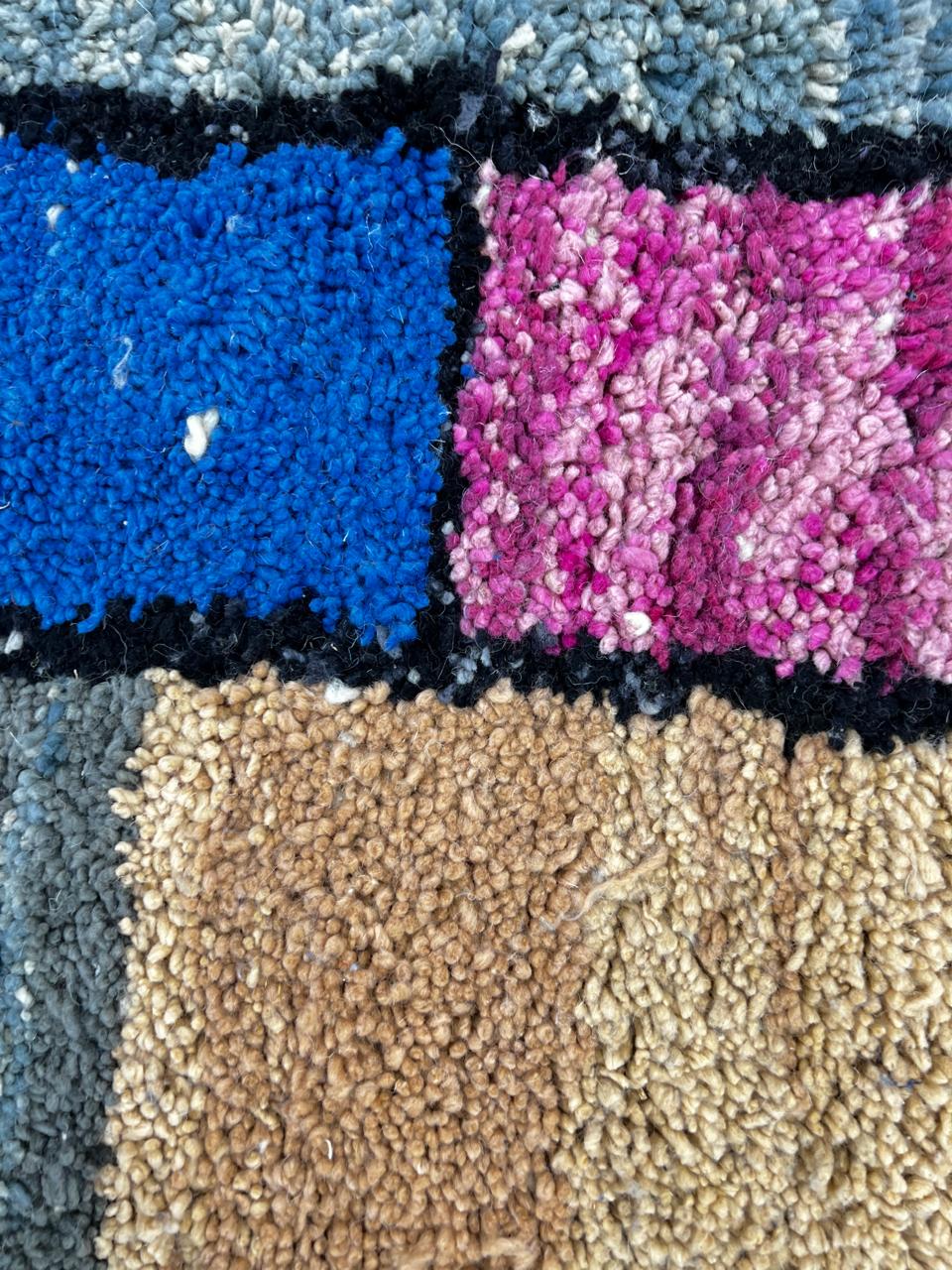 Handwoven colorful Moroccan wool rug with geometric patchwork design – multicolor Berber carpet handmade in Morocco