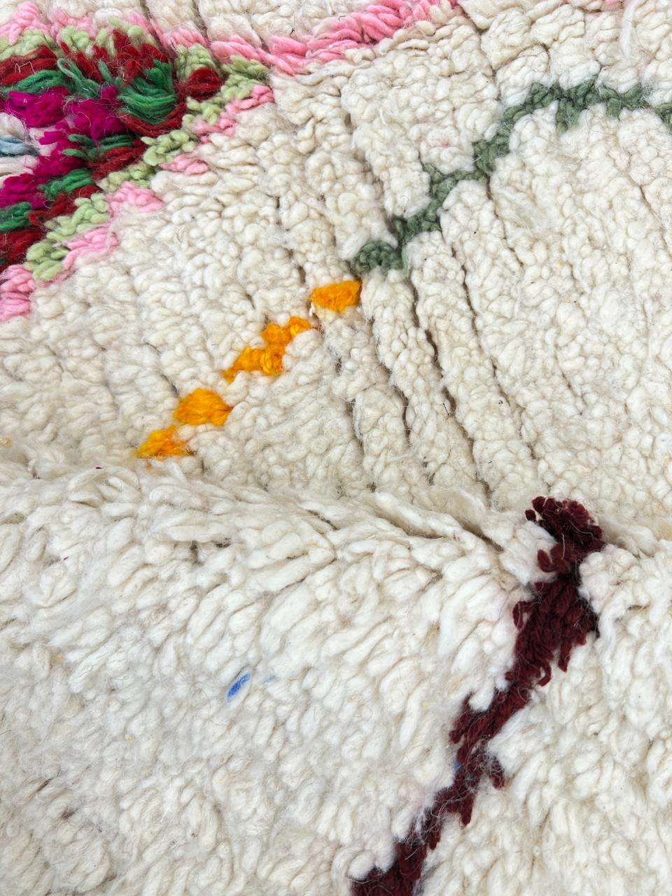 Colorful Moroccan wool rug with handwoven geometric and tribal patterns