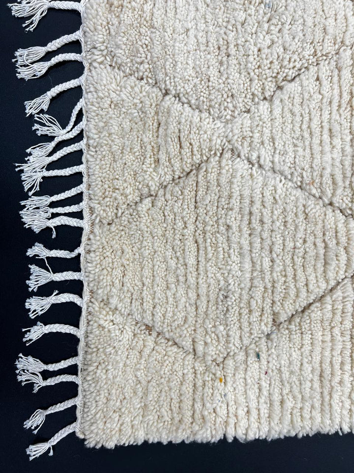 Cream Beni Mrirt Moroccan wool rug with raised diamond pattern, handmade by Berber artisans in the Atlas Mountains