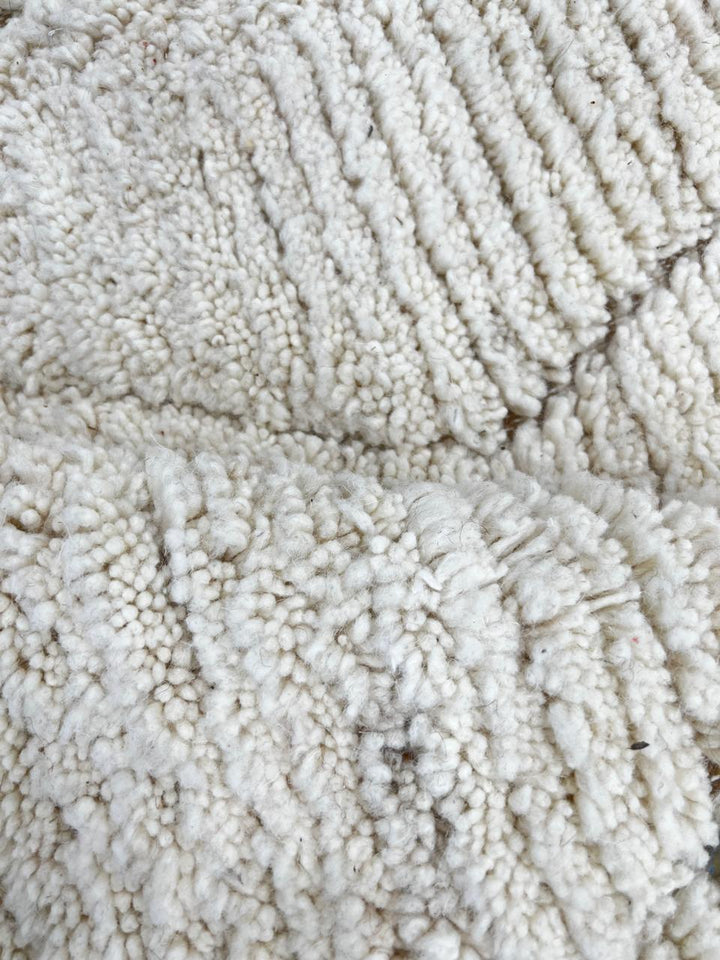 Cream Beni Mrirt Moroccan wool rug with raised diamond pattern, handmade by Berber artisans in the Atlas Mountains