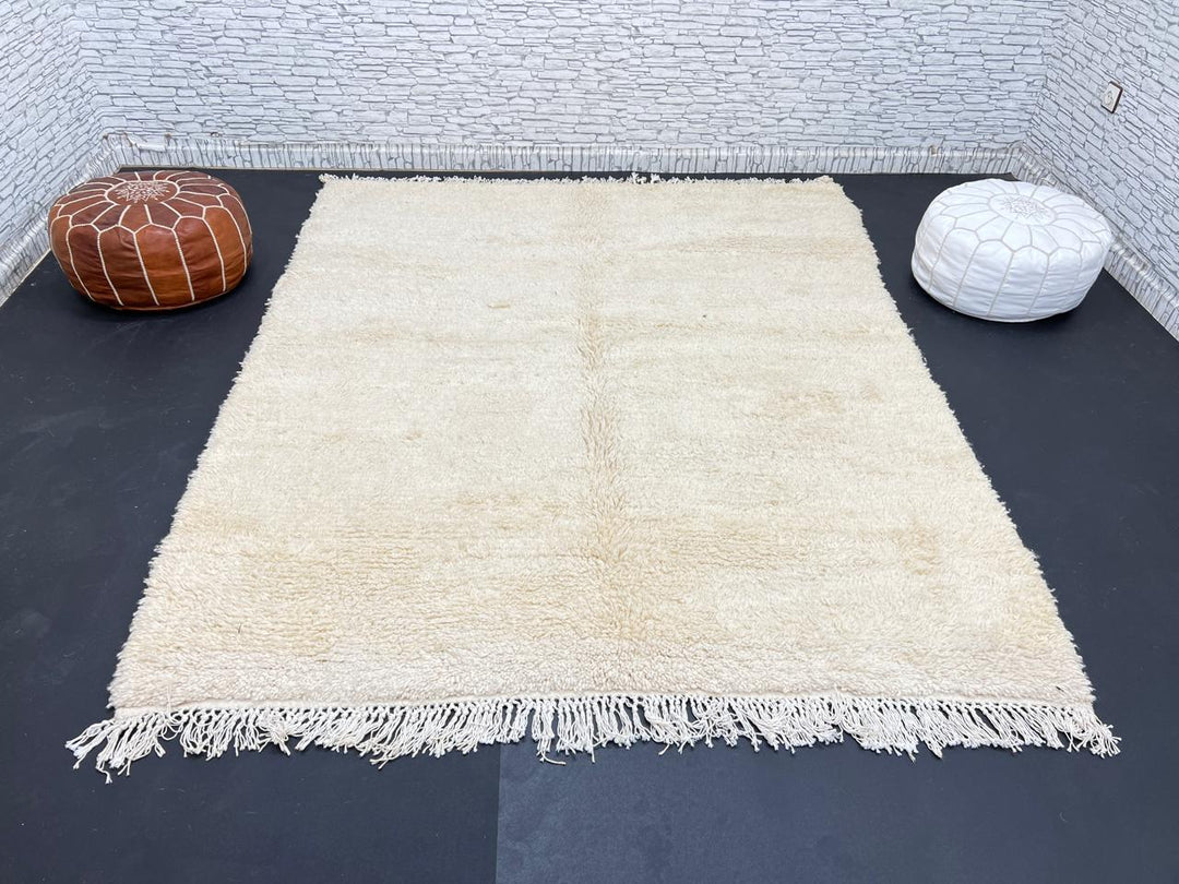 Cream handmade Moroccan wool rug with soft plush texture and fringed edges
