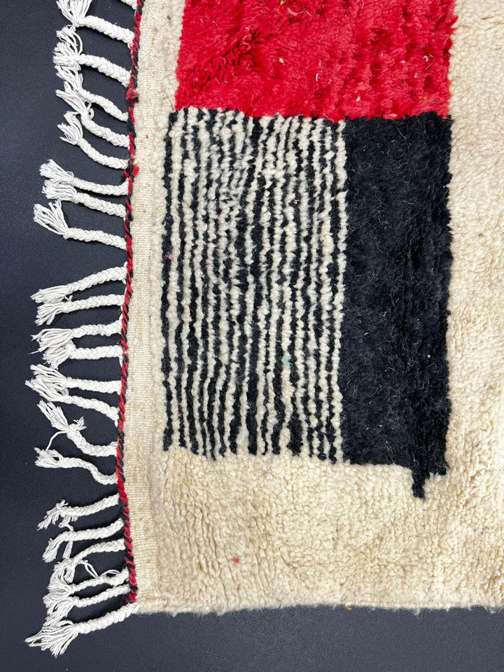 Handmade cream Moroccan wool rug with red and black geometric lines – modern Berber design