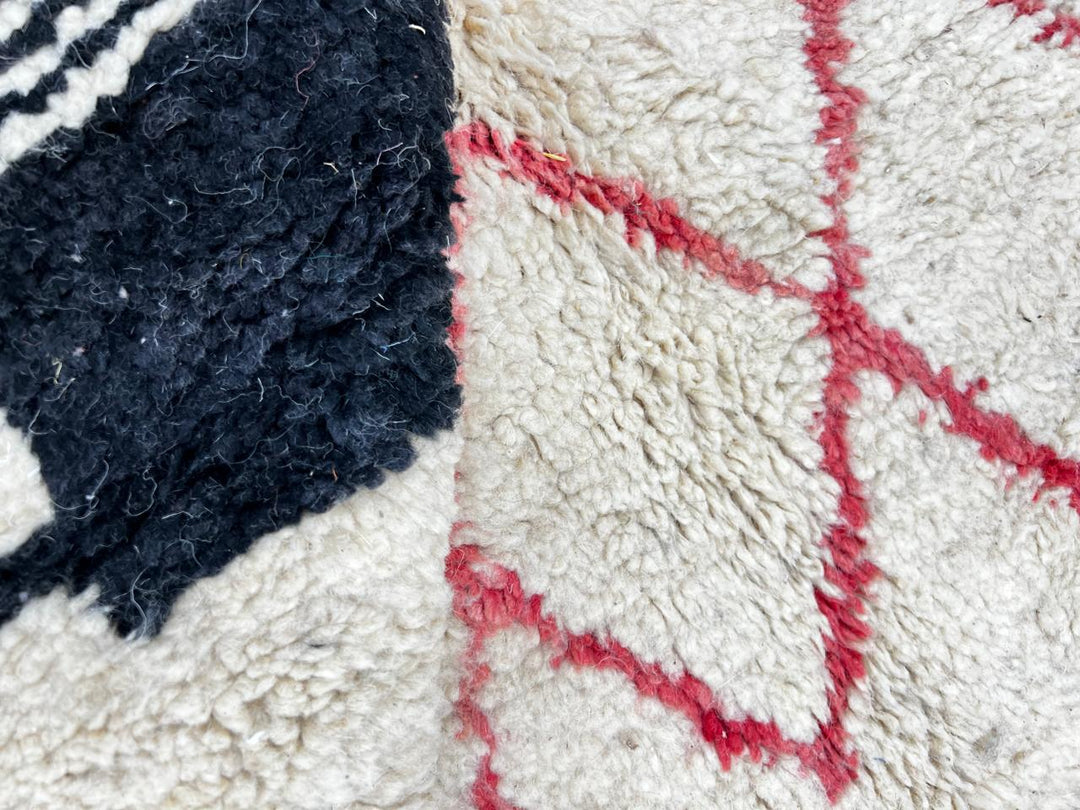 Handmade cream Moroccan wool rug with red and black geometric lines – modern Berber design