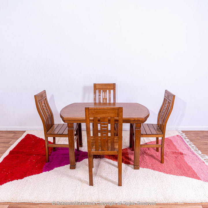 Handmade Moroccan Wool Rug with Red &amp; Pink Hourglass Design under Dining Table Set