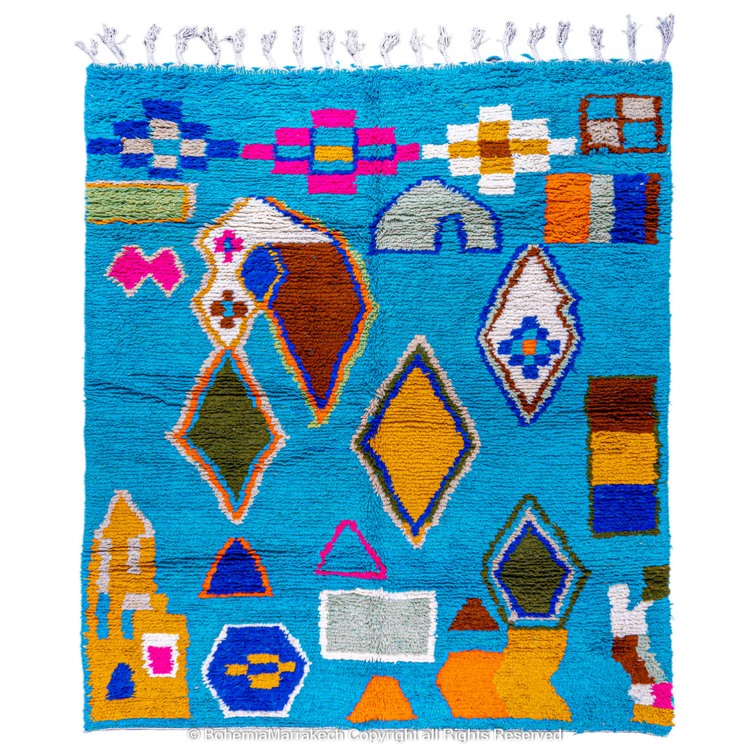 Vibrant blue Moroccan Berber wool rug with geometric symbols, traditional Azilal style, colorful tribal motifs on a vivid background.