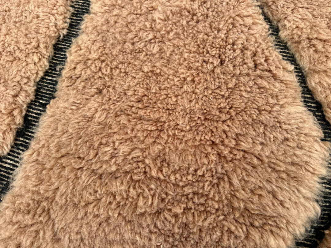 Earth tone Moroccan wool runner rug with carved Berber symbols and black lines