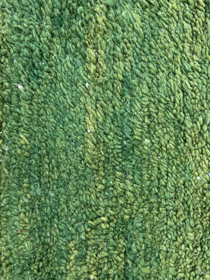 Handwoven green Moroccan wool rug with white geometric line design