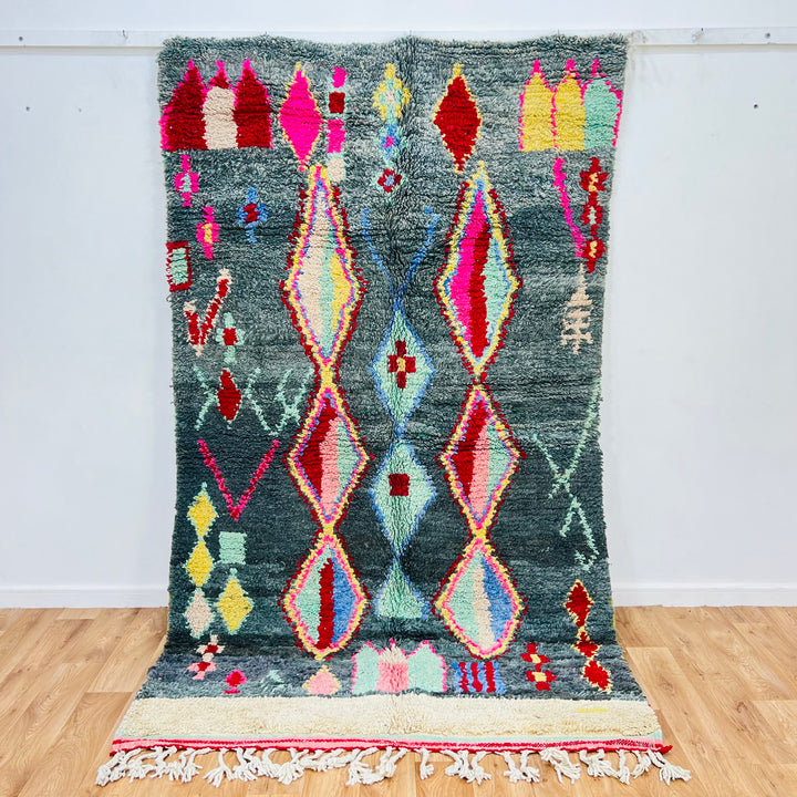 Vintage Moroccan Diamond Rug 258x151 cm with tribal motifs in green, red, pink, yellow, and blue. Handwoven wool by Berber artisans.