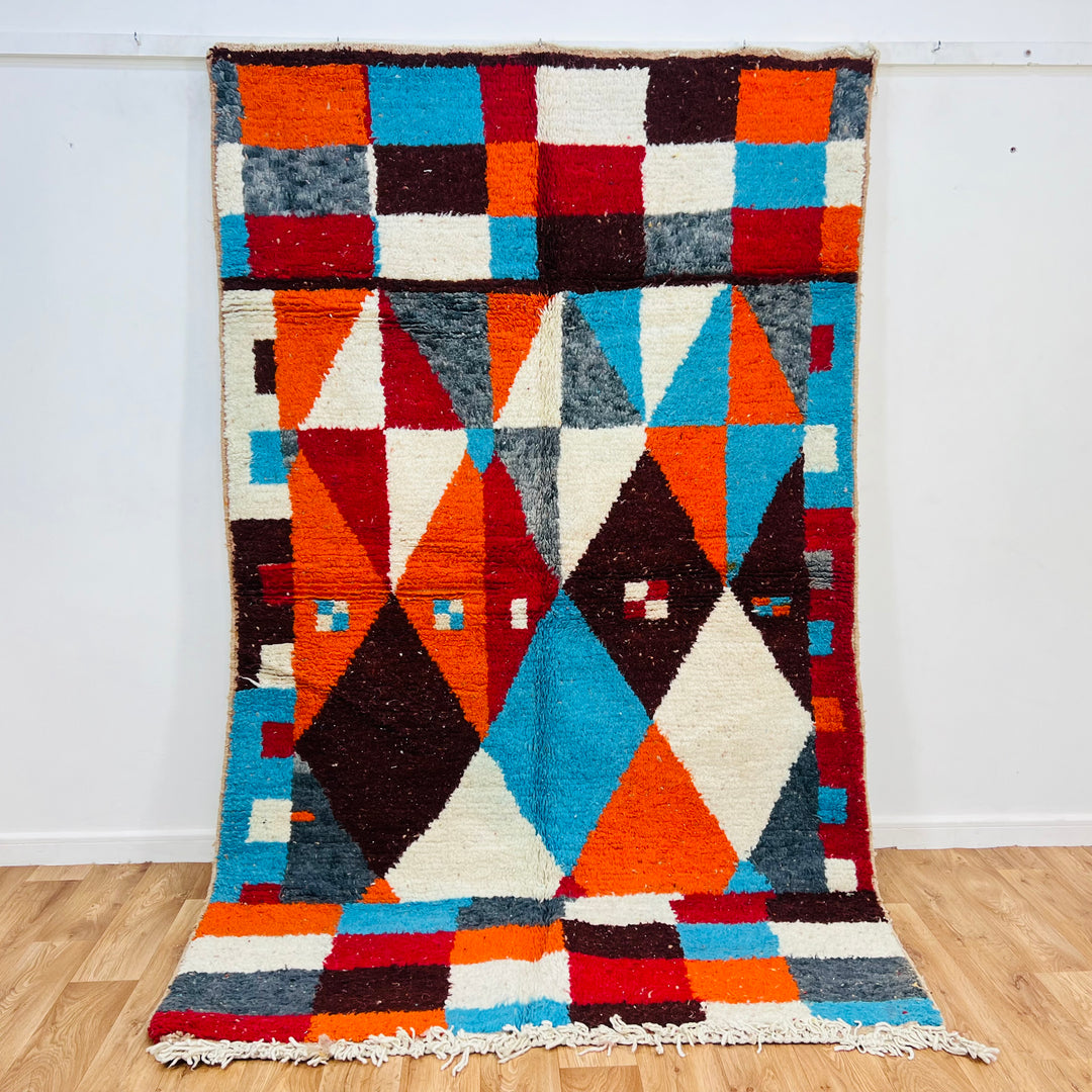 Bold geometric vintage Moroccan berber rug with colorful diamonds, handcrafted from 100% wool. Ideal Moroccan style area rug.