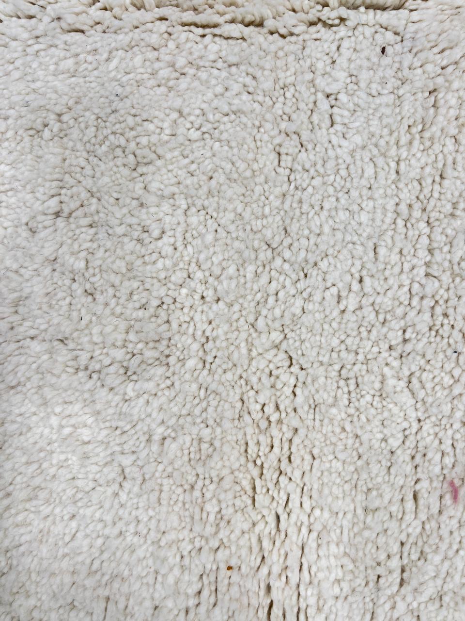 Ivory handmade Moroccan wool rug with plush soft texture and minimalist design