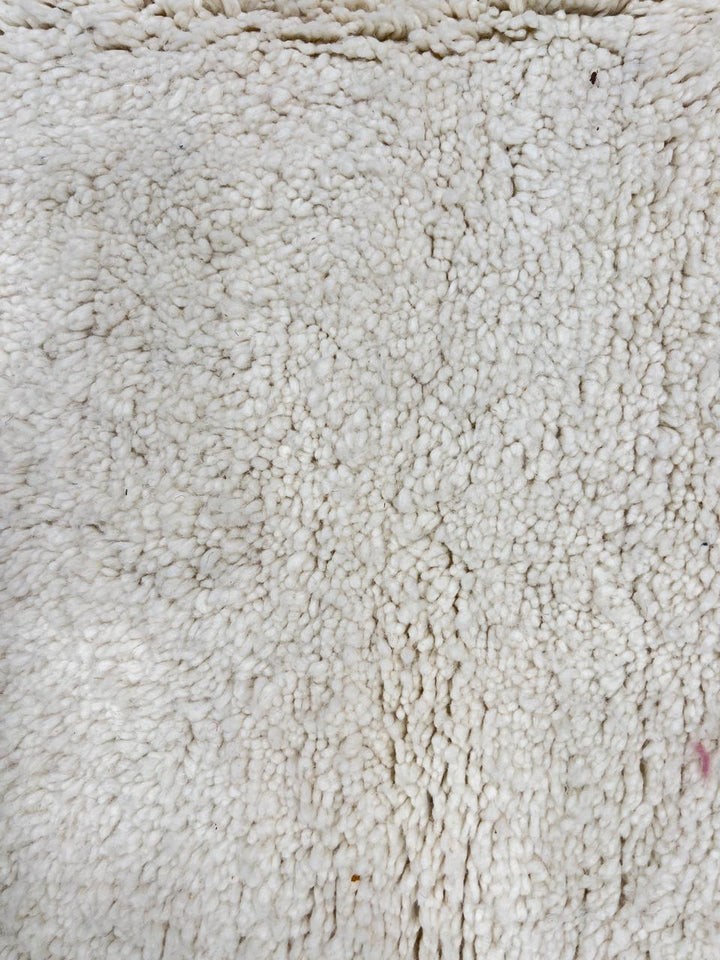 Ivory handmade Moroccan wool rug with plush soft texture and minimalist design