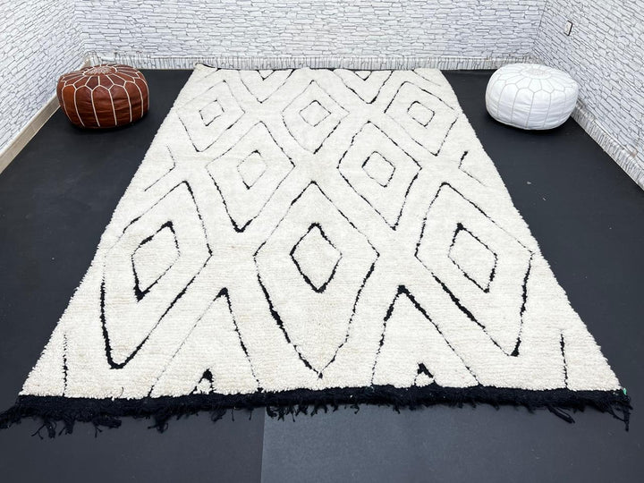 Ivory Moroccan wool rug with black diamond lattice handmade by Berber artisans