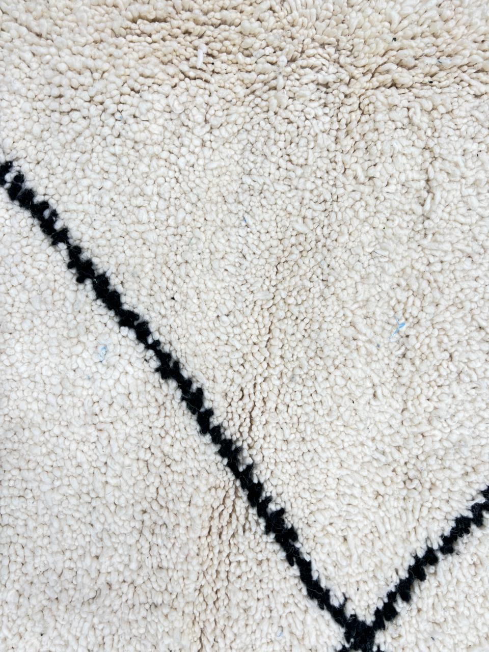 Minimalist Beni Ourain Moroccan wool rug with black diamond pattern