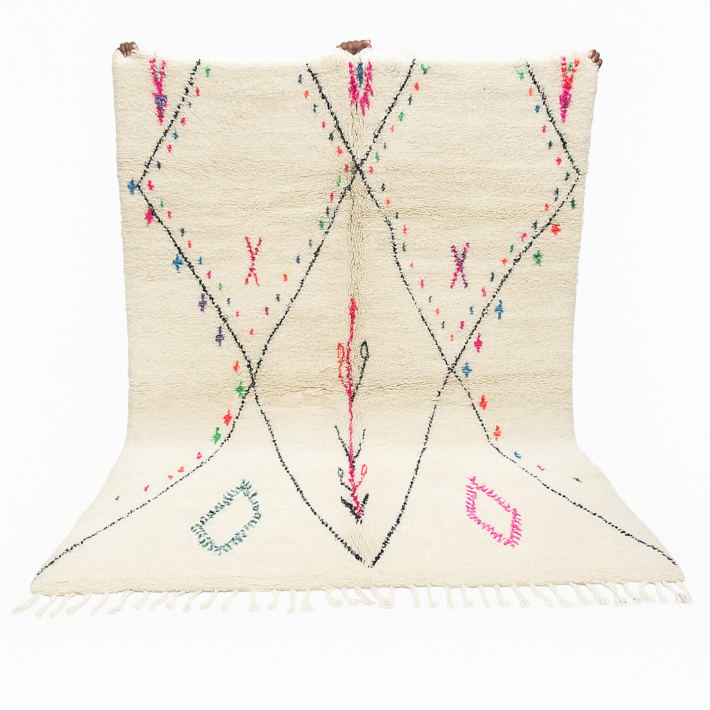 Minimalist Moroccan wool rug with black diamond lines and colorful details on cream background, handmade by Berber artisans