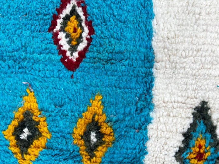 Handmade colorful Moroccan round wool rug with modern patchwork and Berber diamond motifs