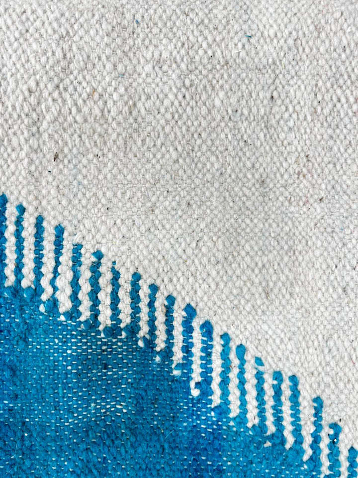 Handmade Moroccan kilim runner rug with purple and blue geometric design on white background, flatwoven hallway runner