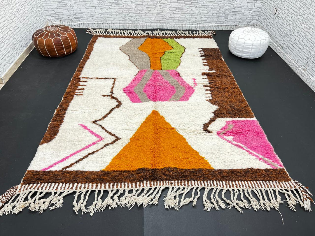 Modern Moroccan wool rug with abstract brown, orange, green, and pink geometric patterns, handmade by Berber artisans