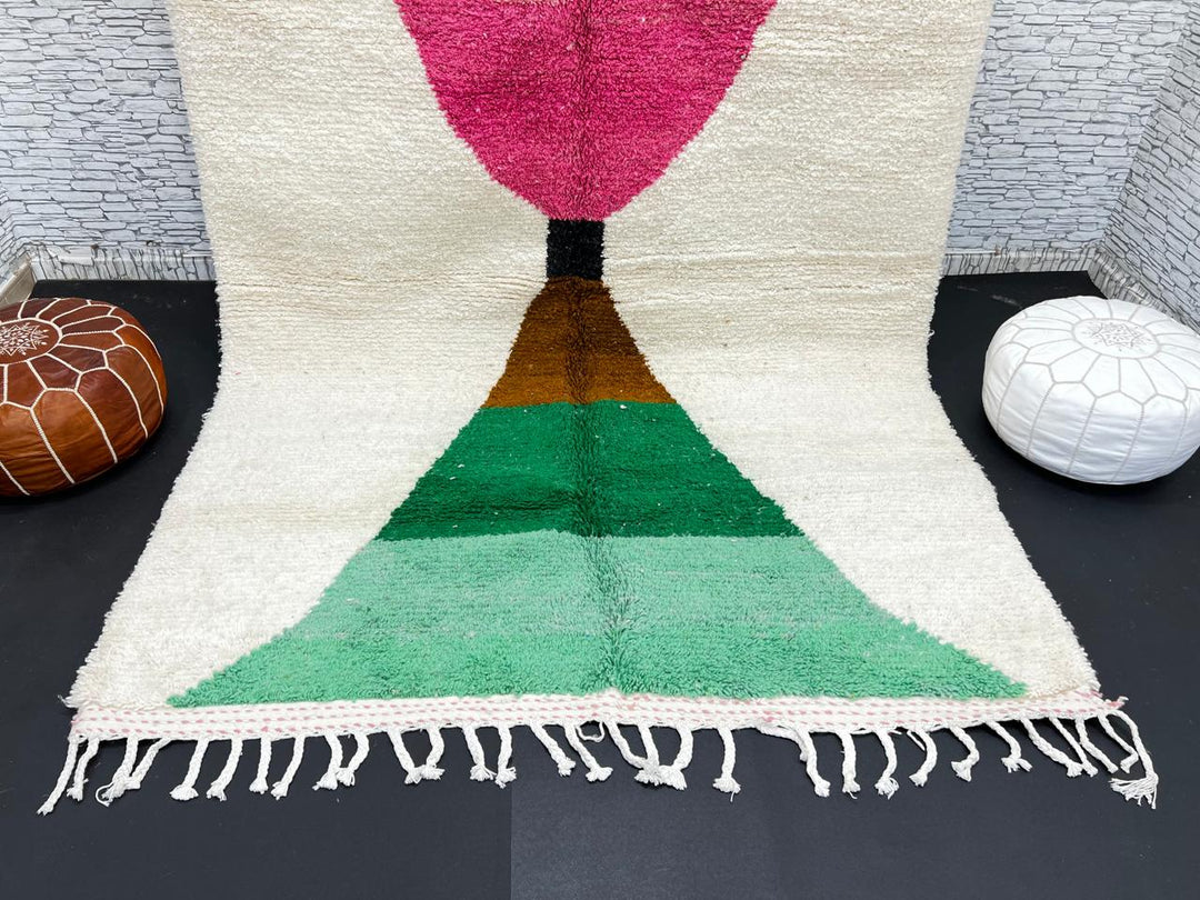 Modern Moroccan wool rug with pink and green hourglass geometric design, handmade by Berber artisans