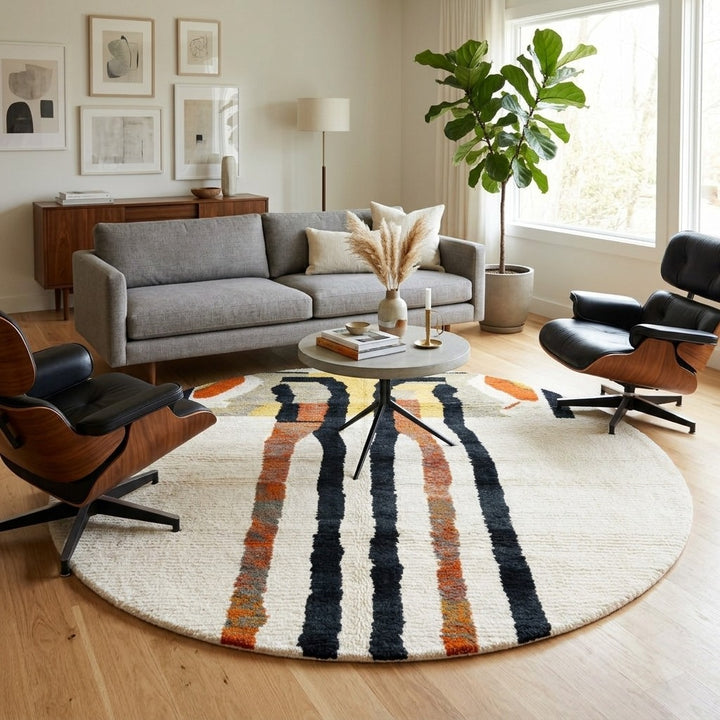 Round Moroccan wool rug with abstract black and rust lines on white background